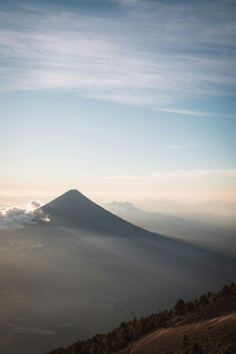 Volcano casting a long shadow at sunrise